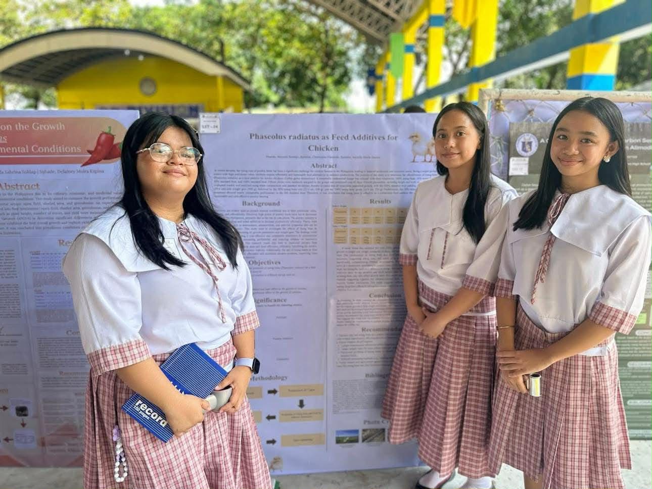 STE student researchers presenting a scientific study poster