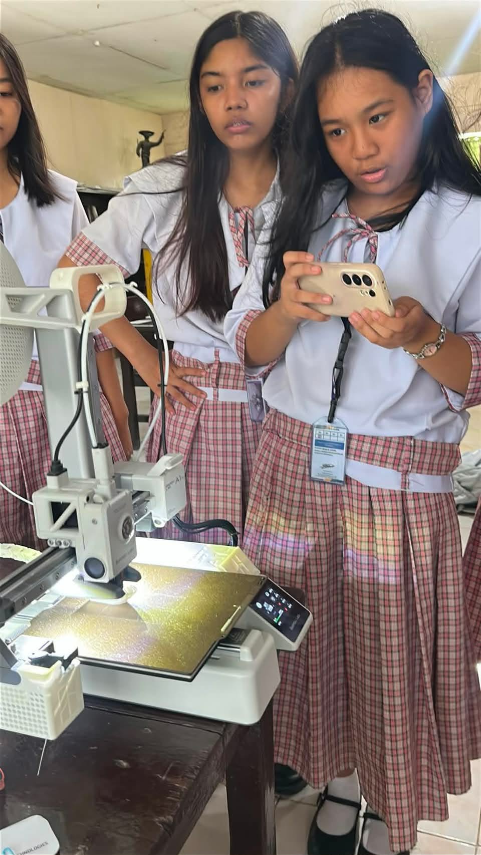 Students demonstrating a measurement prototype