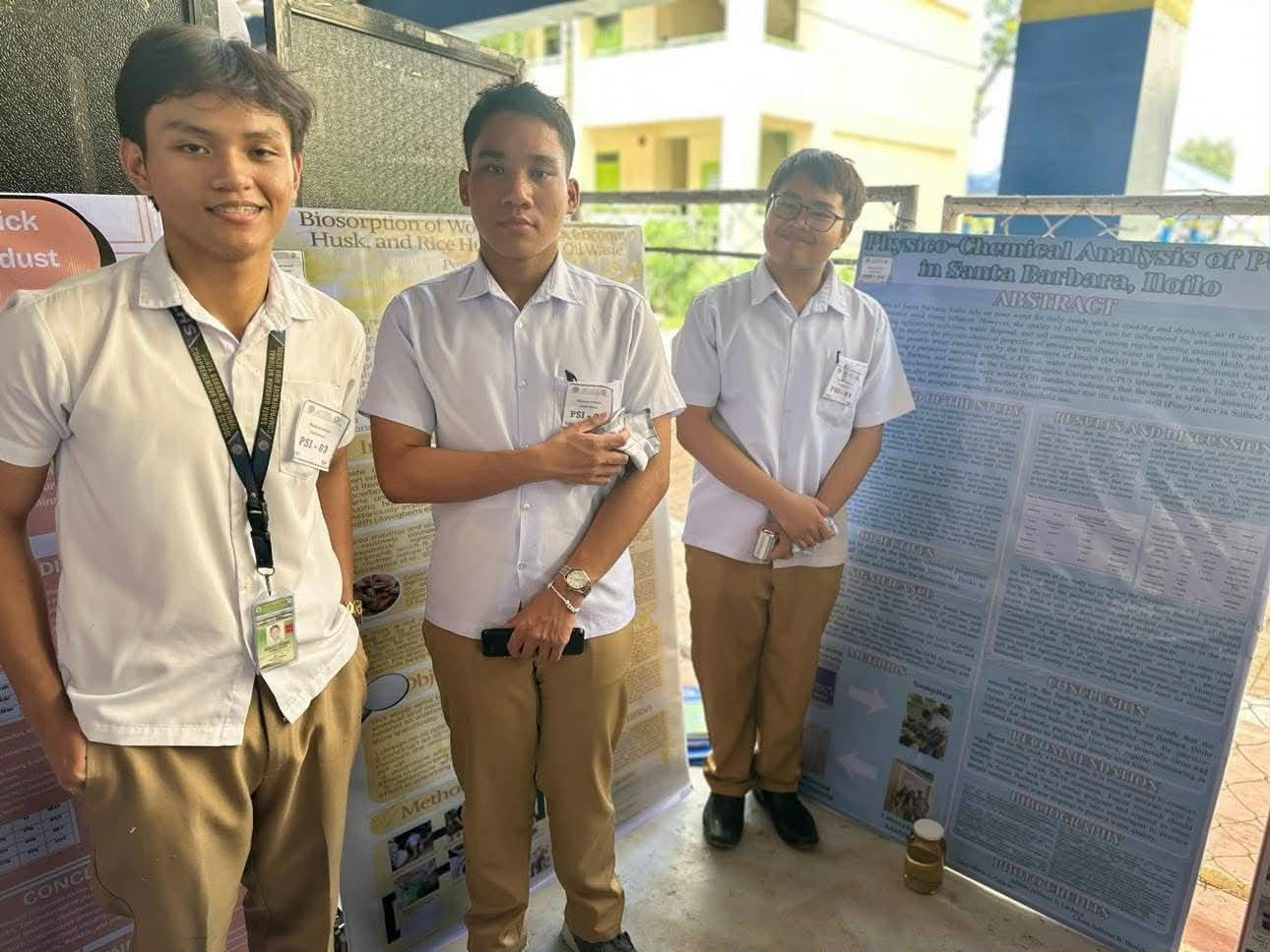 Close-up of students testing a circuit with a laptop